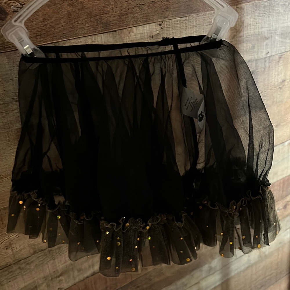 Curtain Call Costumes black shiffon skirt with yellow gold ruffled bottom.